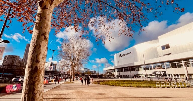 Adidas Arena Paris Visitor Guide 2026: The Honest Truth about Safety, Hotels & Getting There 2 Esplanade de l'Adidas Arena Paris par une journée ensoleillée — Porte de la Chapelle Paris 18