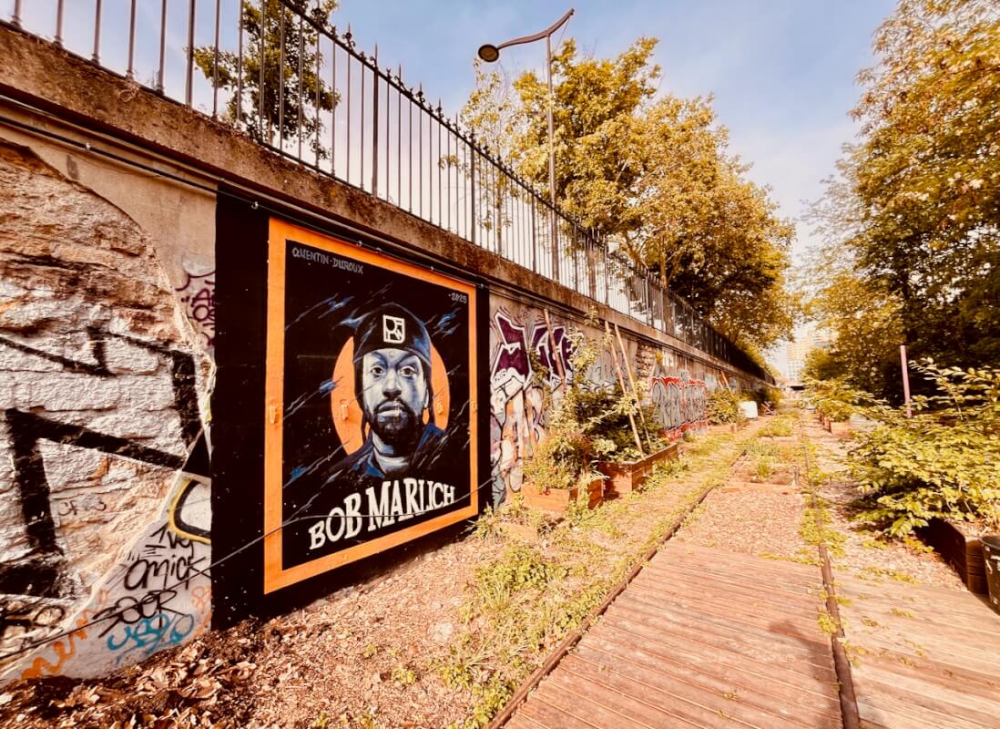 Jardin des Traverses: Paris's Hidden Railway Garden Near Adidas Arena 4 Bob Marley mural by Quentin Duroux 2025 — Jardin des Traverses Paris 18