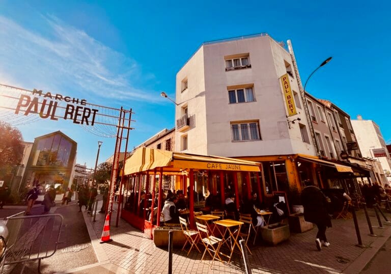 Weekend in Paris: Morning at the Saint-Ouen Flea Market & Evening at Adidas Arena (The Perfect Itinerary) 4 Paris flea market itinerary — Marché Paul Bert Serpette entrance and Café Jaune terrace, Saint-Ouen