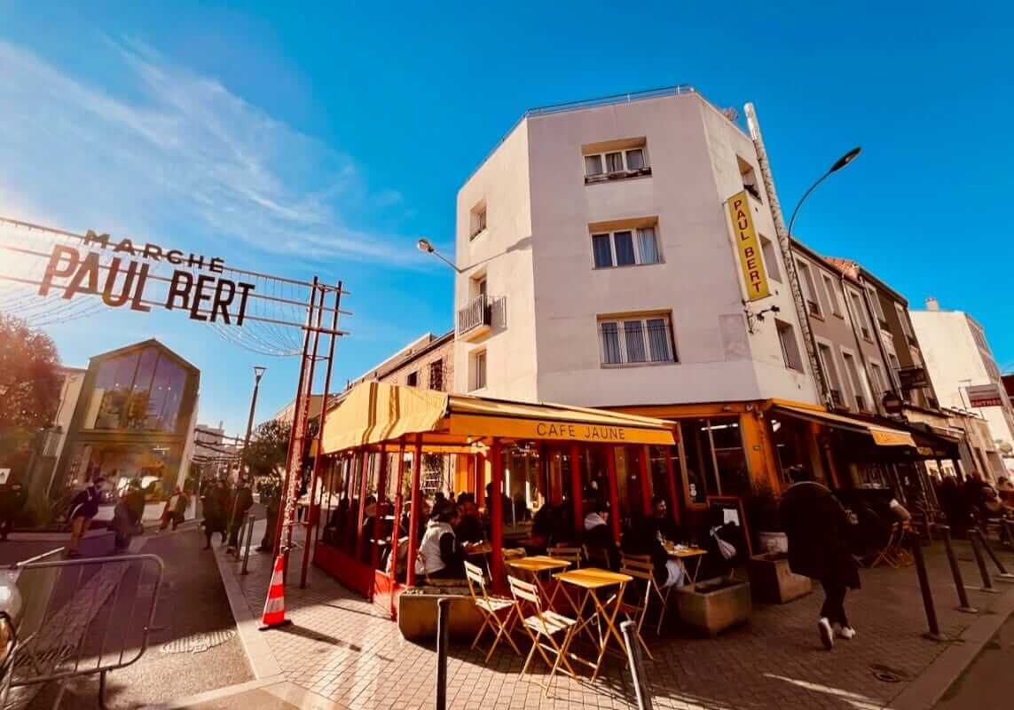 Weekend in Paris: Morning at the Saint-Ouen Flea Market & Evening at Adidas Arena (The Perfect Itinerary) 2 Marché Paul Bert Saint-Ouen yellow café terrace on a Sunday morning